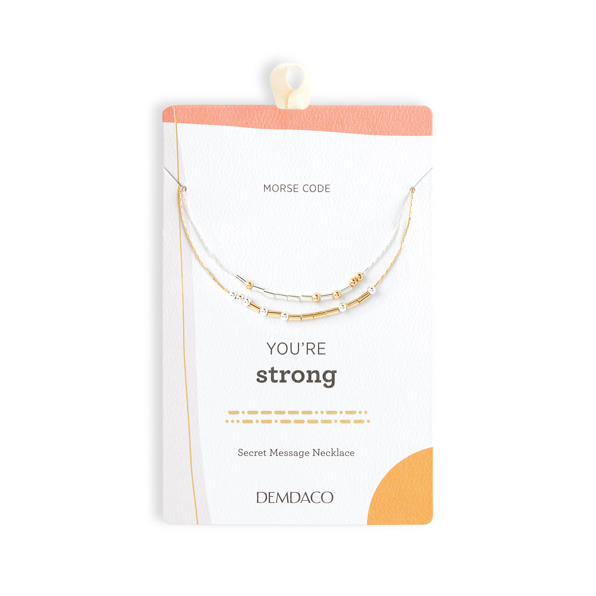 A gold and silver message necklace displayed on a white card with a peach header. The card reads 'MORSE CODE', 'YOU'RE strong', and 'DEMDACO', indicating the brand and product type.
