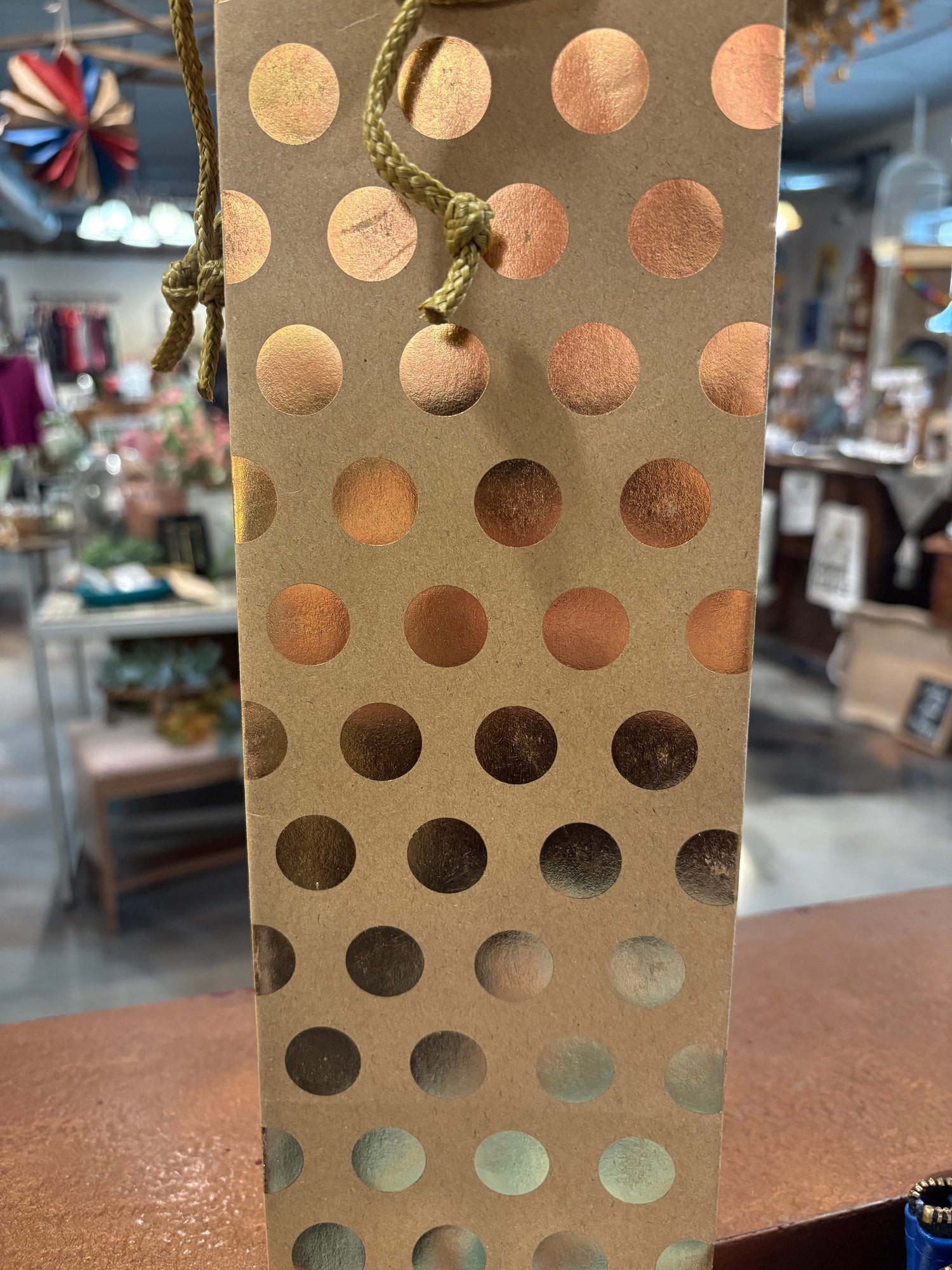 Gold makeup palette with circular patterns on a blurred background Wine Gift Bag