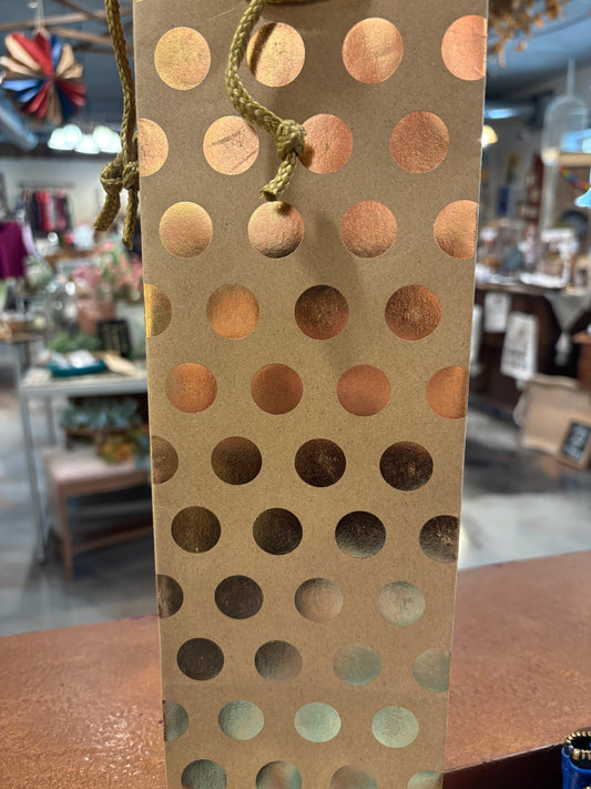Gold makeup palette with circular patterns on a blurred background Wine Gift Bag