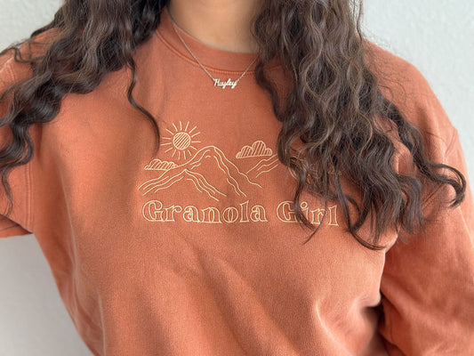 Terra Cotta Colored crewneck sweatshirt worn by a woman with long brown hair on white background