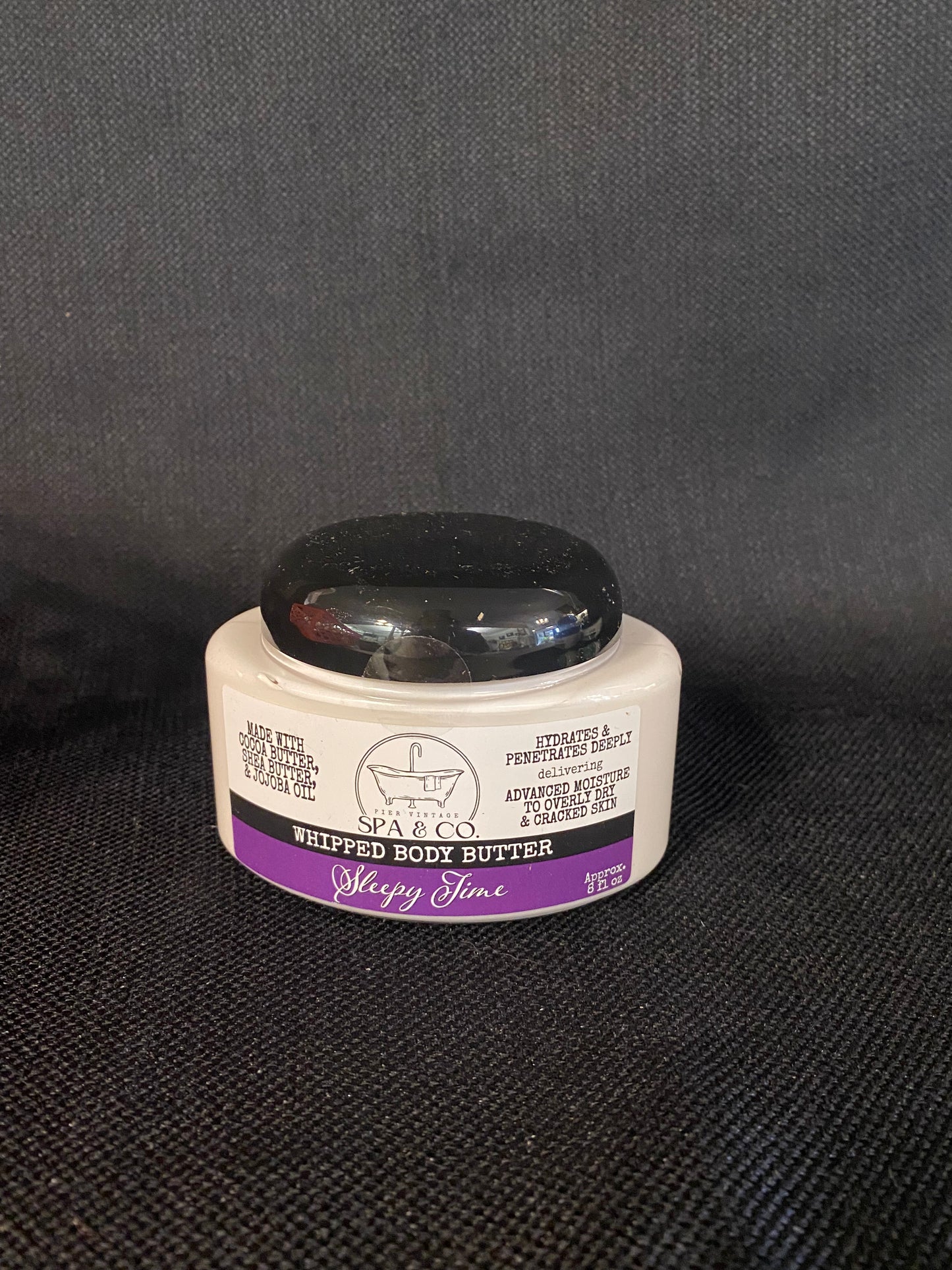 Container of Whipped Body Butter called Sleepy Time by Pier Vintage Spa & Co. on a dark textured surface