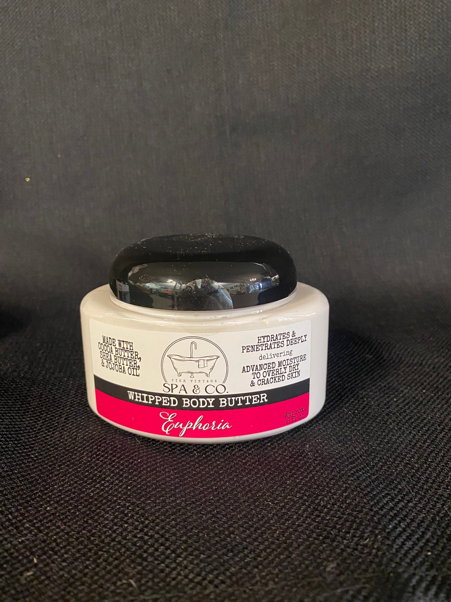 Container of Whipped Body Butter called Euphoria by Pier Vintage Spa & Co. on a dark textured surface