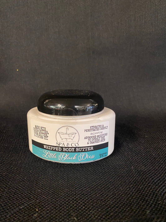 Container of Whipped Body Butter called Little Black Dress by Pier Vintage Spa & Co. on a dark textured surface