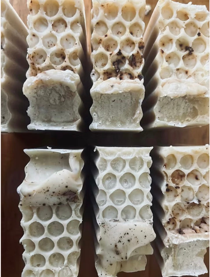 Close-up of a honeycomb bar of soap  with a cross-shaped cutout.