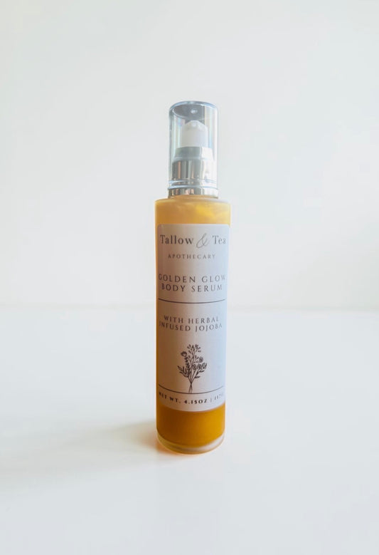Bottle of Tallow & Tea Apothecary body serum golden glow body serum with herbal infused jojoba on a white background