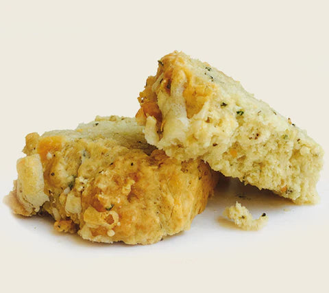 Cheesy Garlic Soberdough Beer Bread pieces on white background