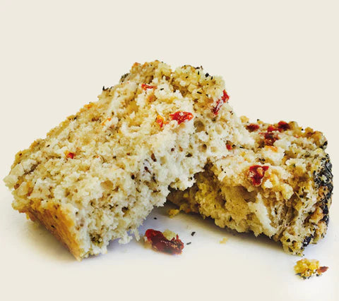 Sun Dried Tomato Soberdough Bread pieces on white background