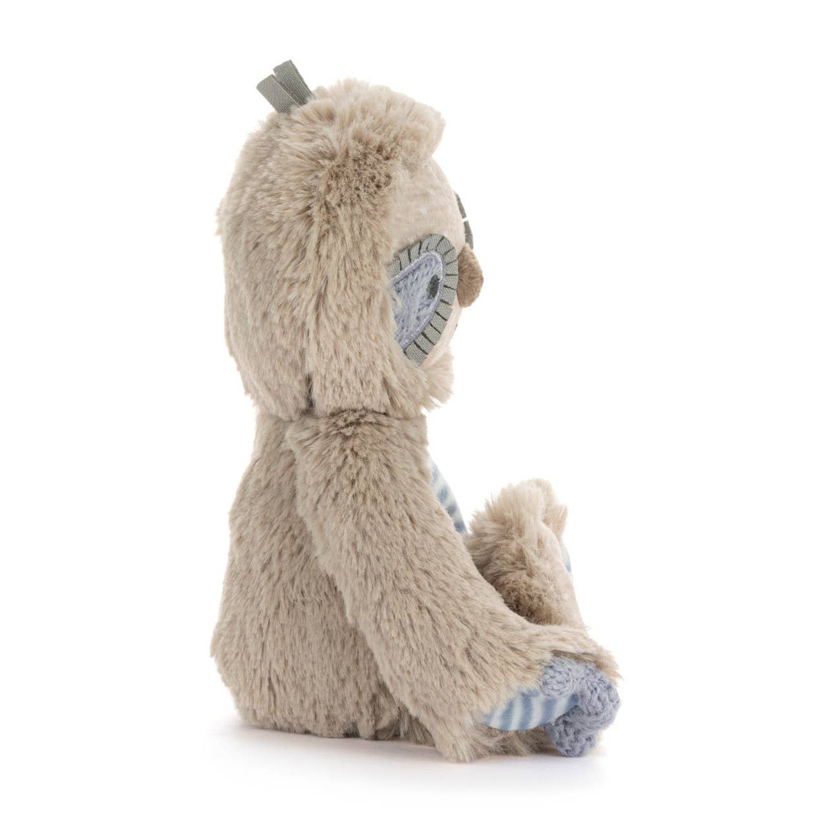 Plush toy with a hood and striped feet on a white background