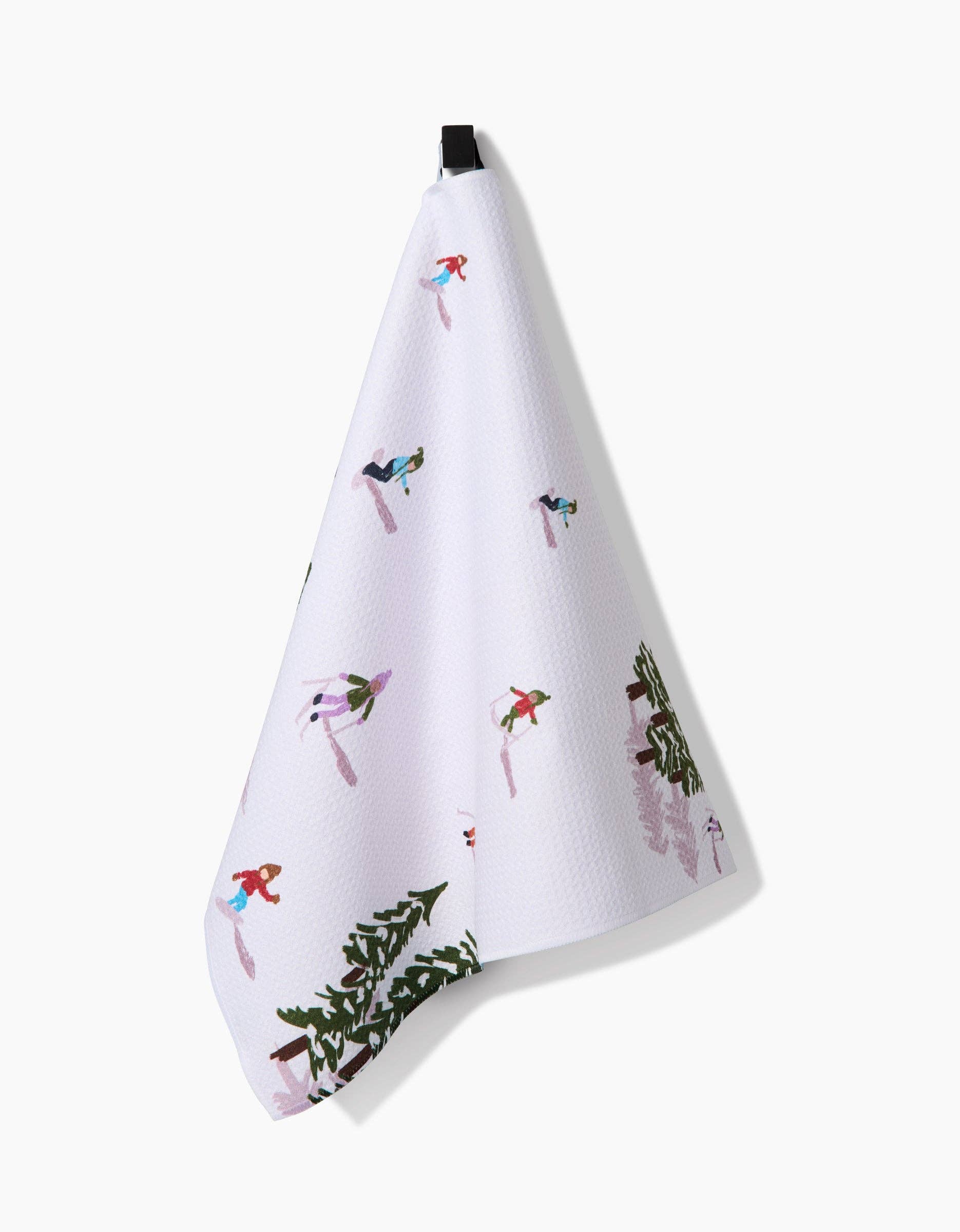 White towel with winter-themed designs on a white background