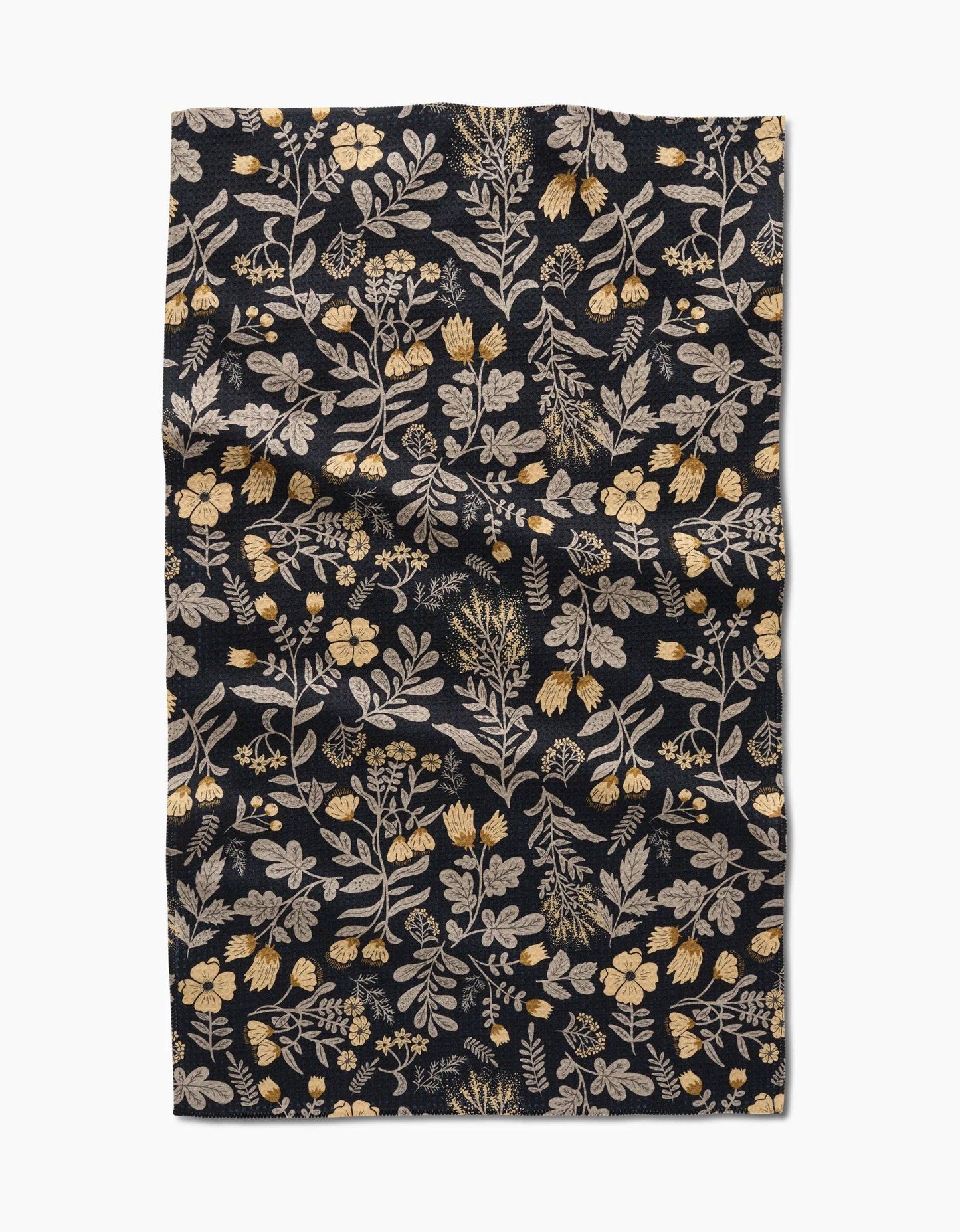 Geometry kitchen tea towel with floral patterned fabric on a black background