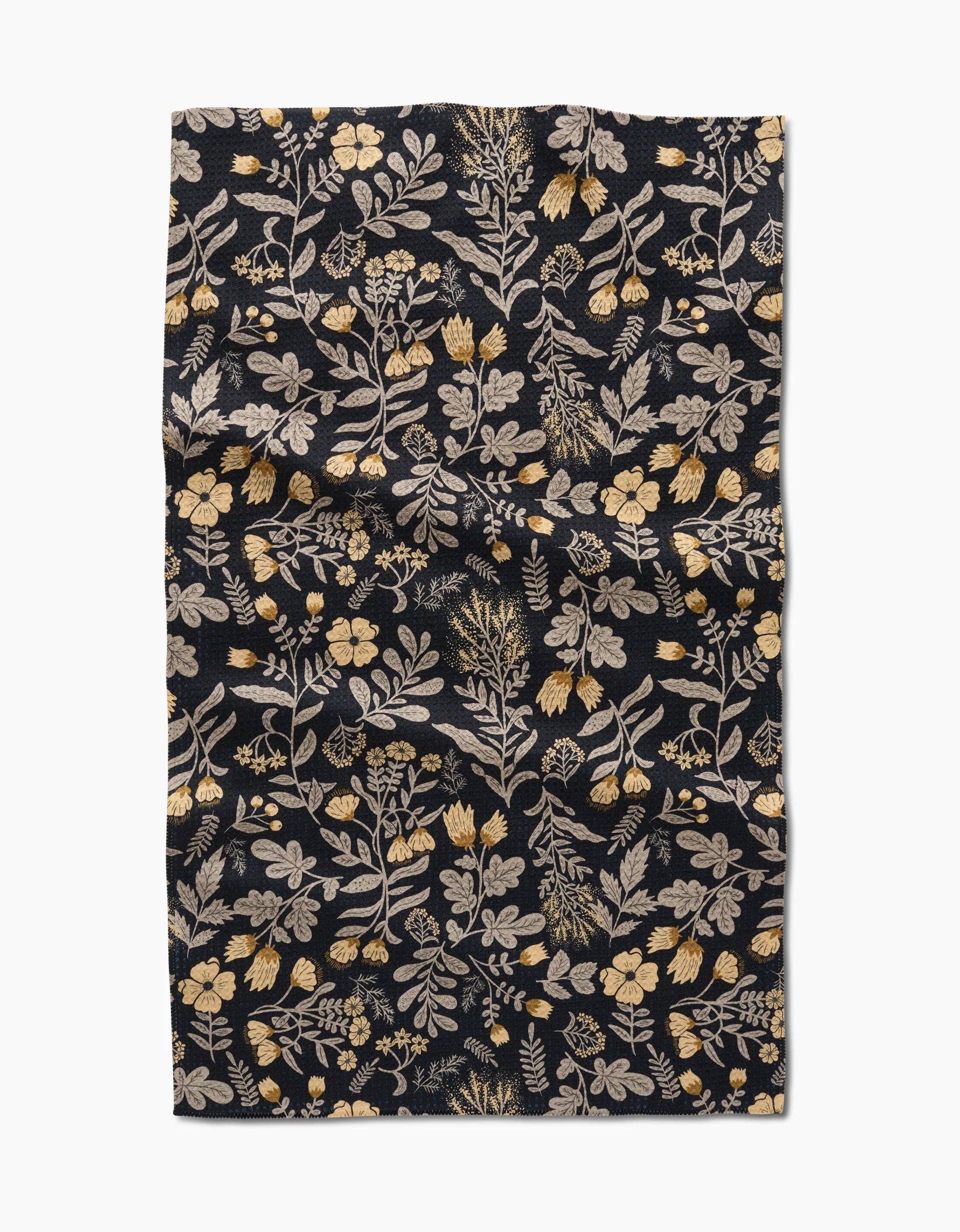 Geometry kitchen tea towel with floral patterned fabric on a black background