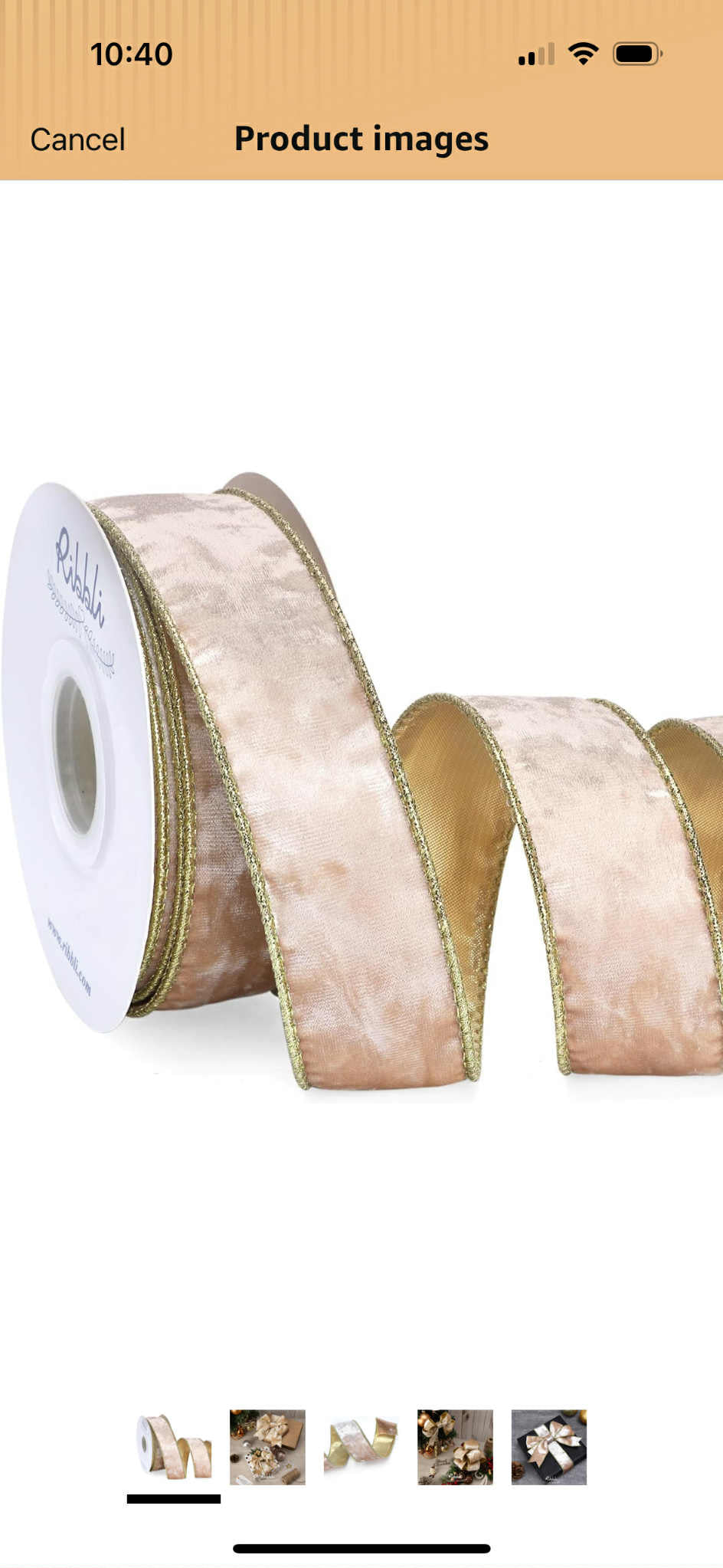 Champagne ribbon with gold trim on white roll on white background