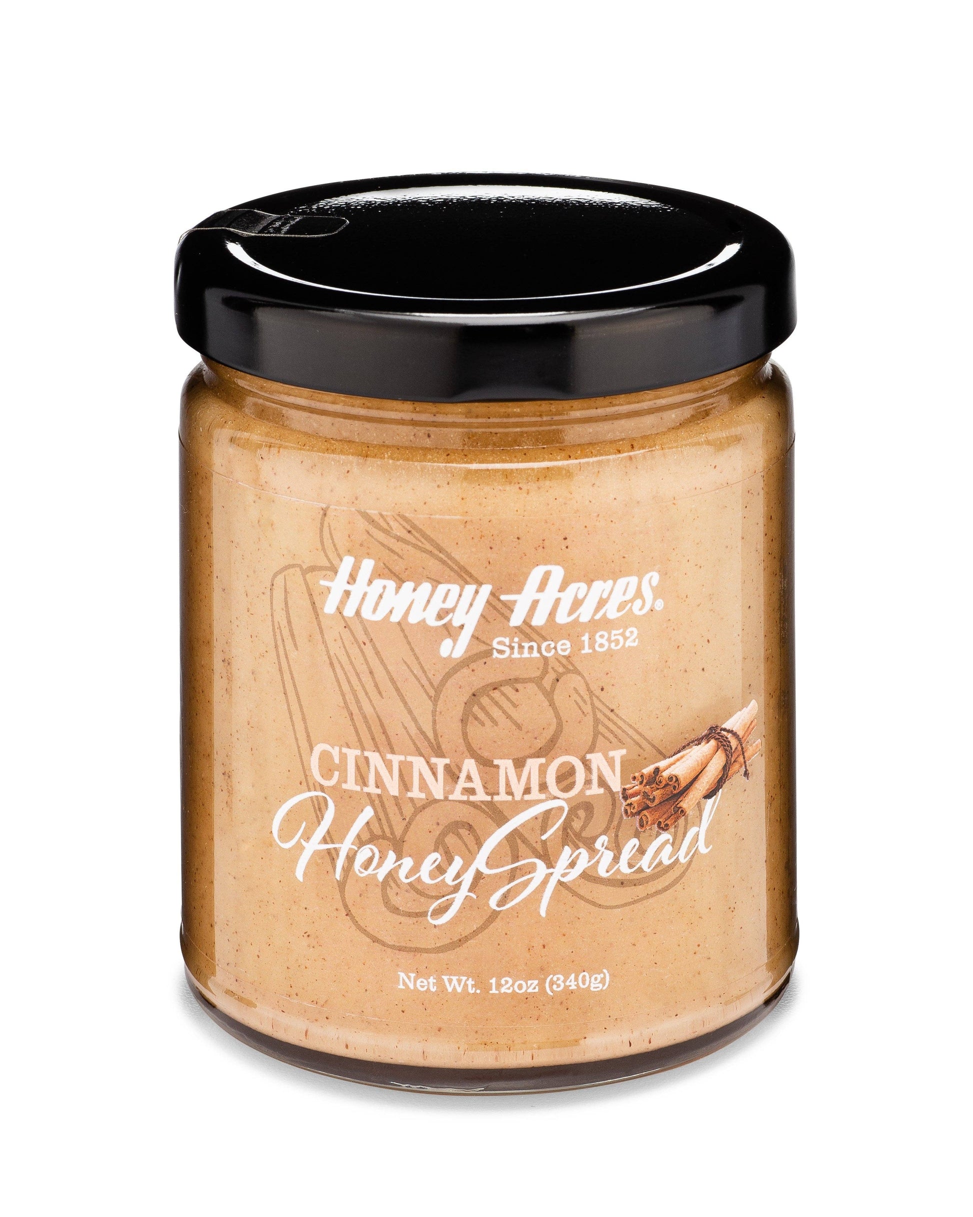 Jar of Honey Acres Cinnamon Honey Spread on a white background