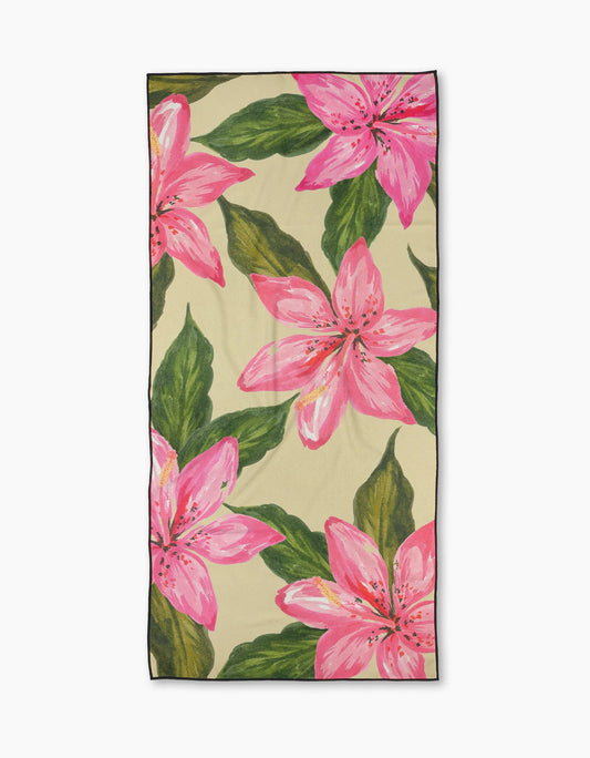 Towel with pink floral design on a beige background