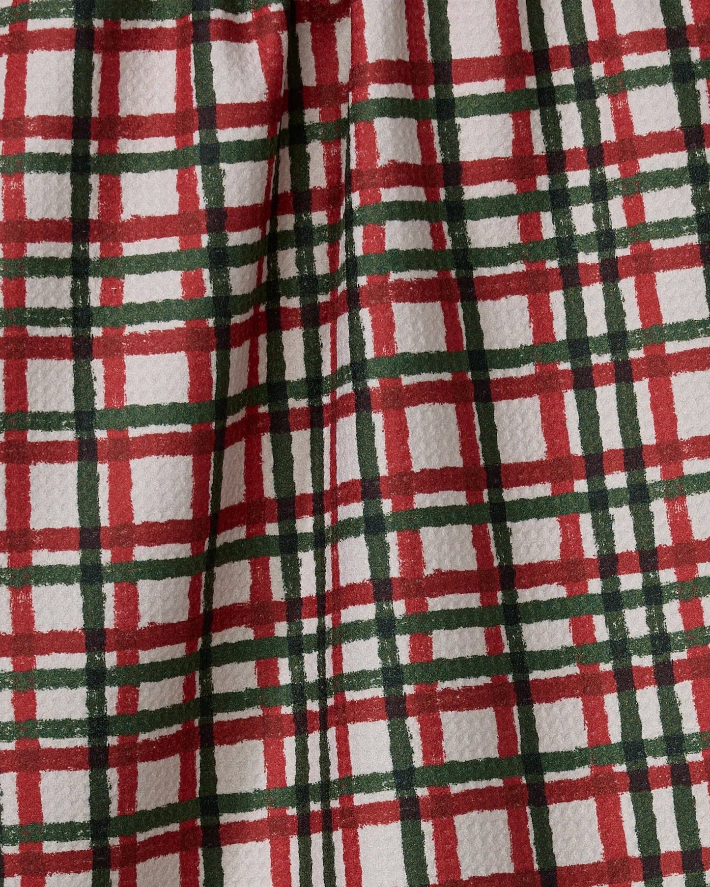 Close-up of red, green, and white plaid fabric of Geometry Tea Towel