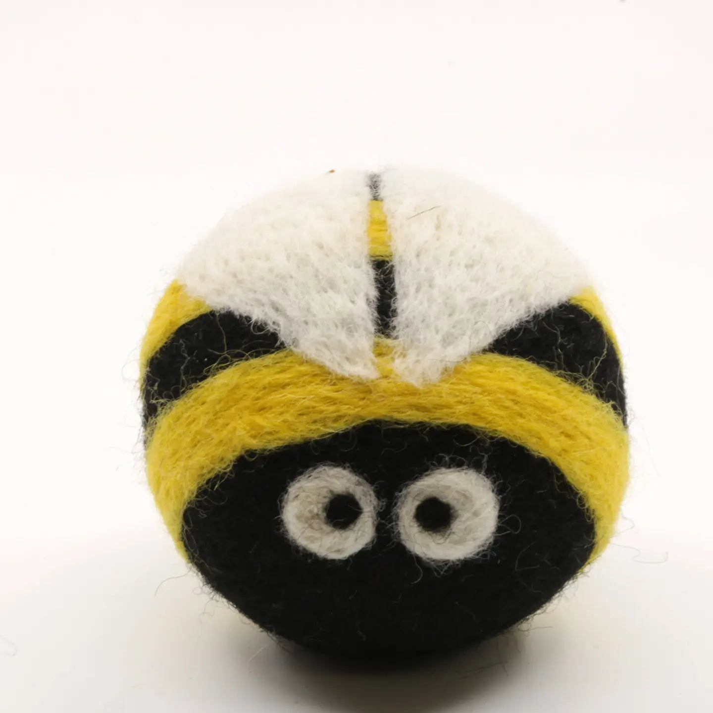 Felted wool dryer ball shaped like a bee on a white background