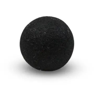 Black wool dryer ball on a white background