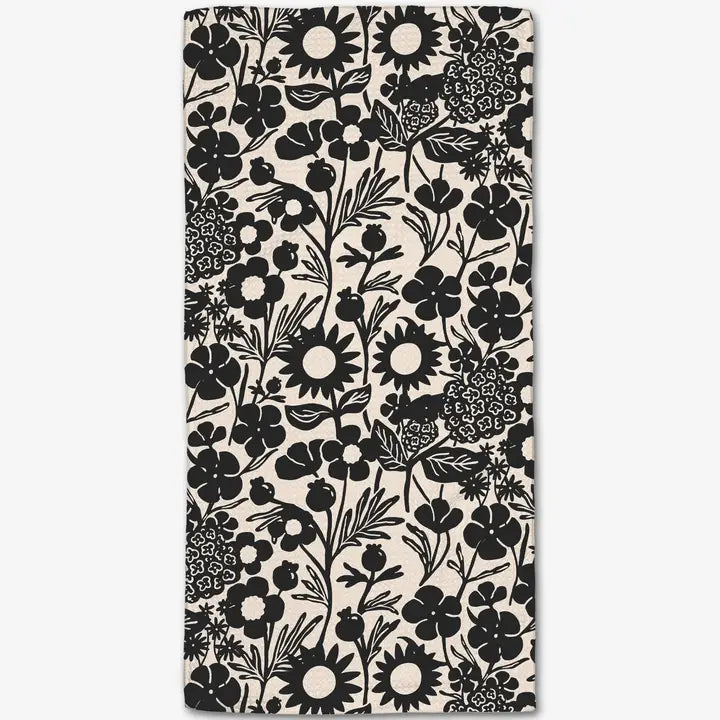 Geometry bar towel with floral patterned fabric with black flowers on a white background