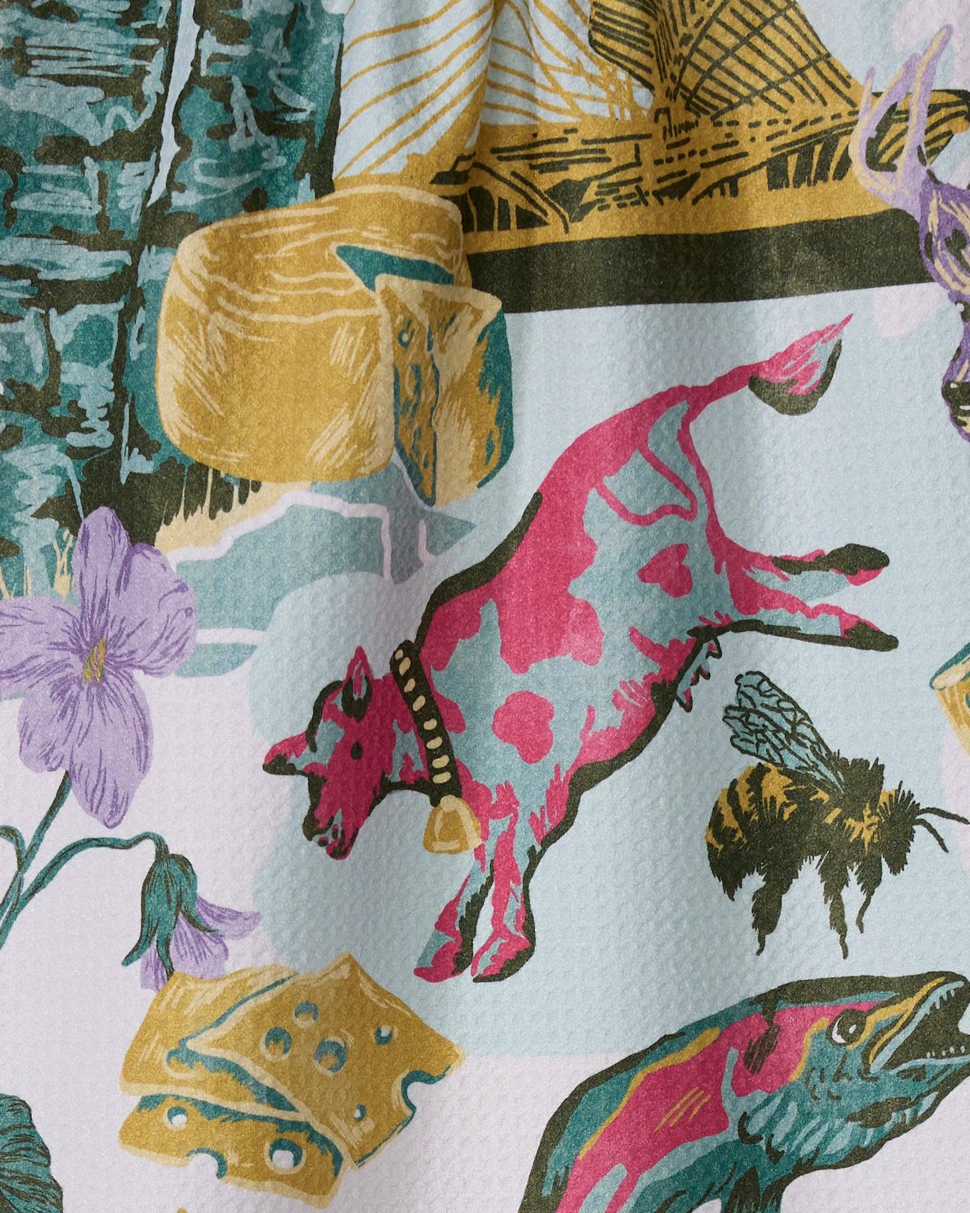 Geometry Tea Towel with Colorful fabric with a pattern of a pink cow, bee, and fish on a white background.