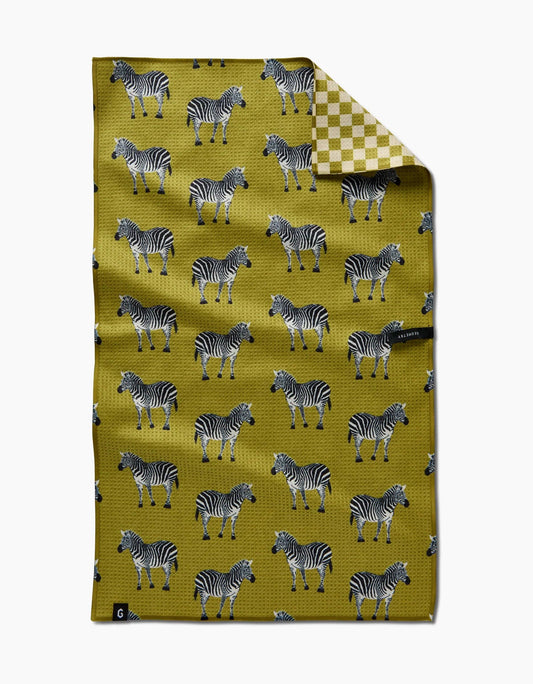 Folded fabric with zebra pattern on a yellow background