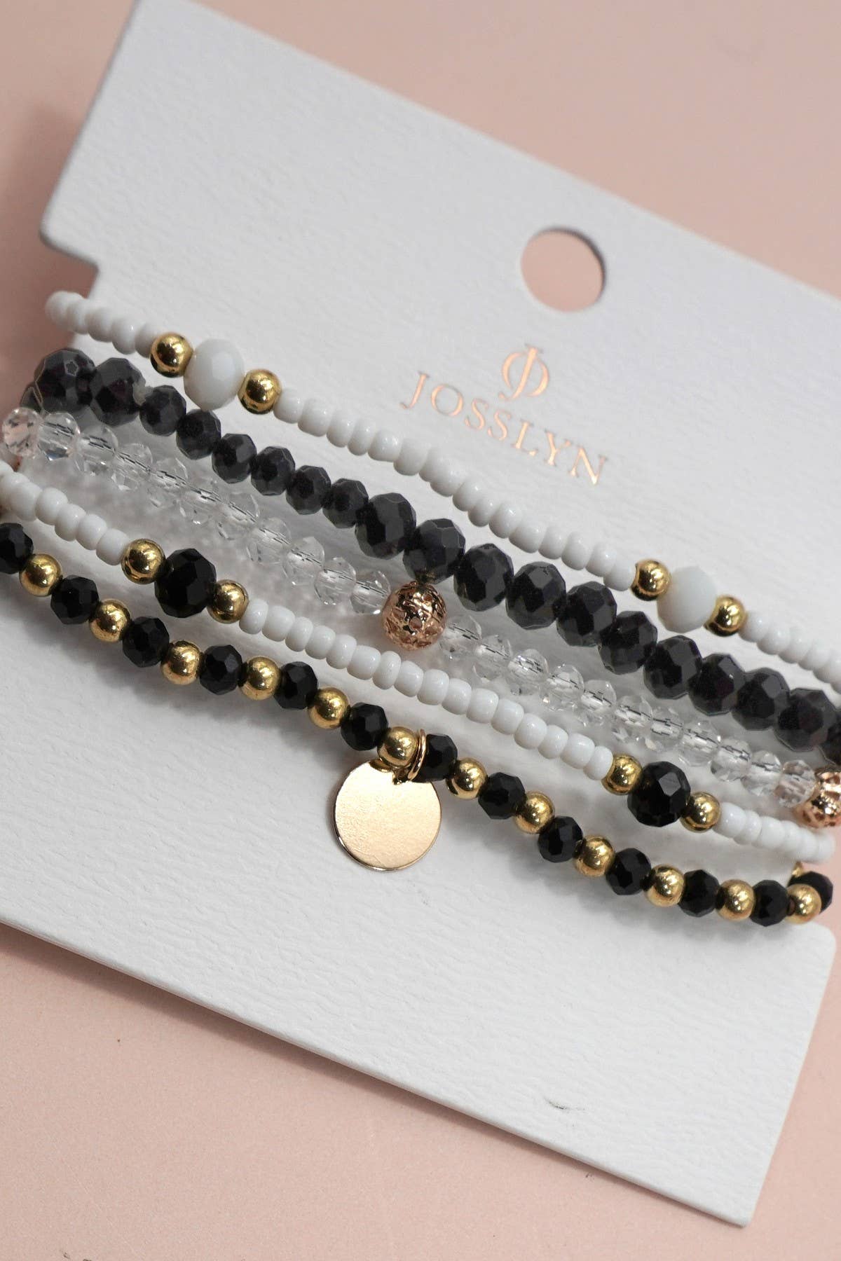 Set of beaded bracelets on a white card with 'Josslyn' brand name.