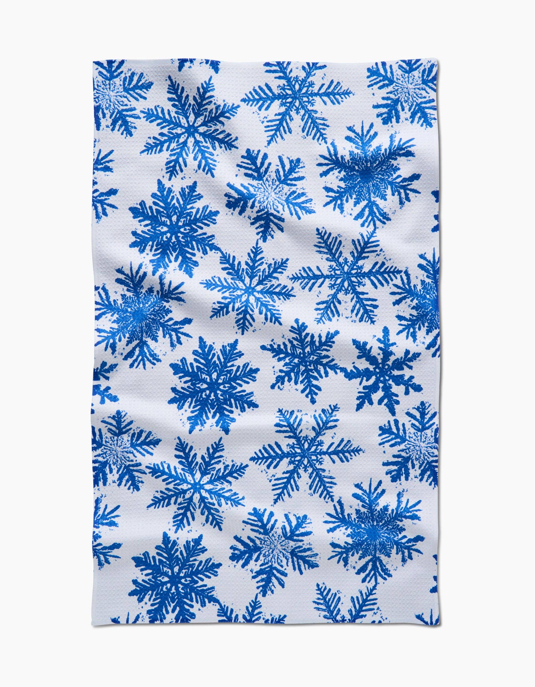 Geometry Kitchen Tea Towel with blue snowflake pattern on a white background
