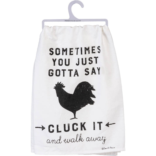 White towel with black text and rooster graphic on a hanger