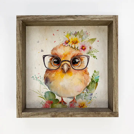 sweet chick with glasses on a spring bouquet in a wooden frame on white background