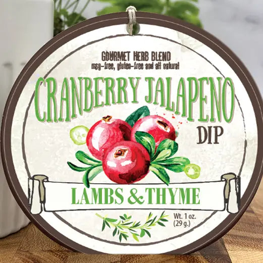 Label for Cranberry Jalapeno Dip by Lambs & Thyme on a wooden surface.