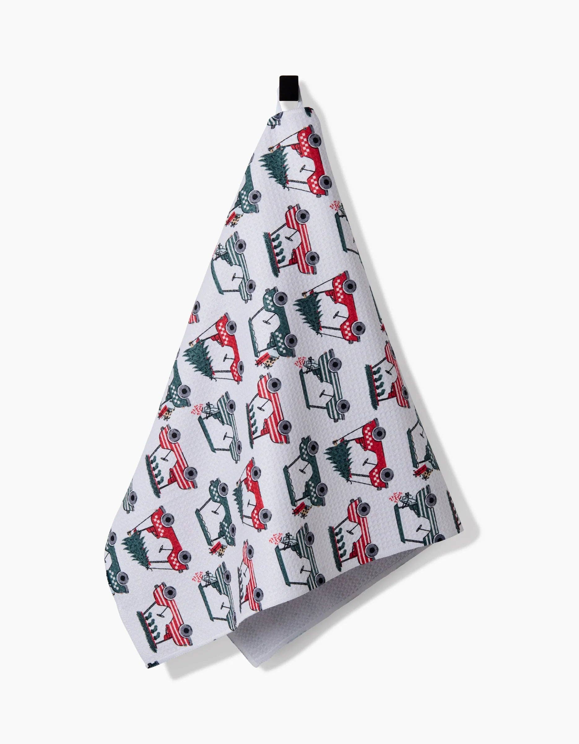 Geometry Tea Towel with golf cart pattern hanging on a white background