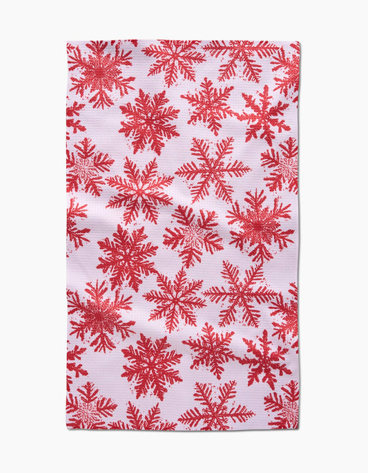 Red snowflake pattern on a white background