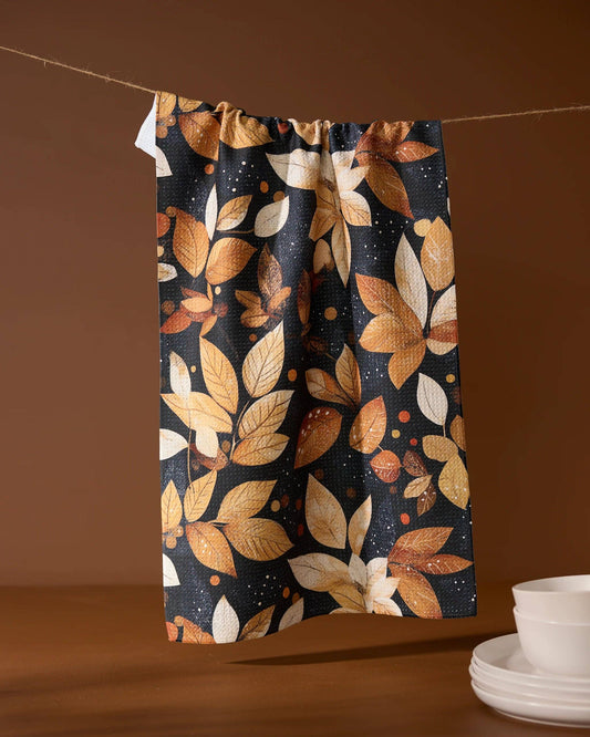 Geometry Kitchen Tea Towel with autumn leaf pattern on a brown background