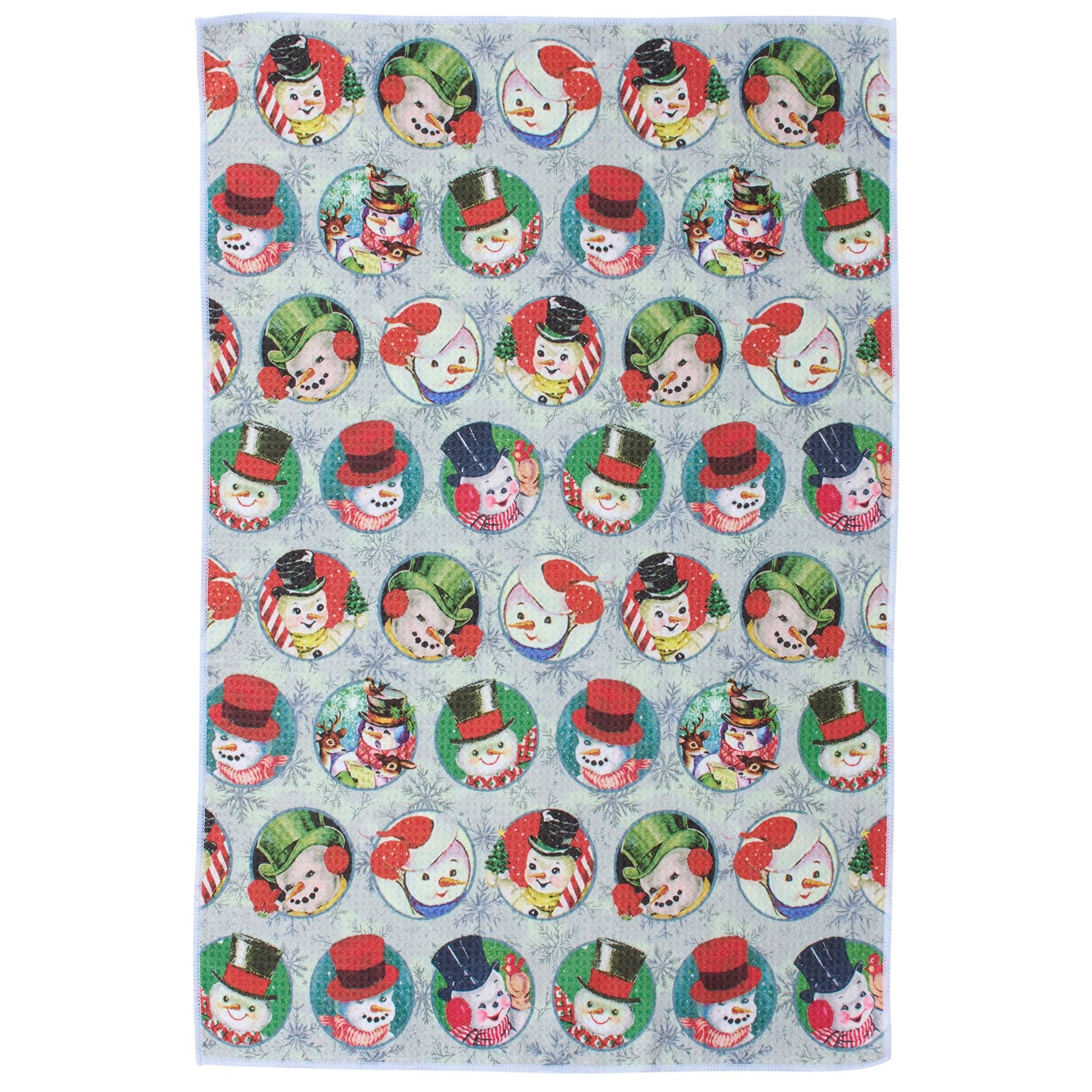 Patterned kitchen towel with colorful snowmen faces on a blue background