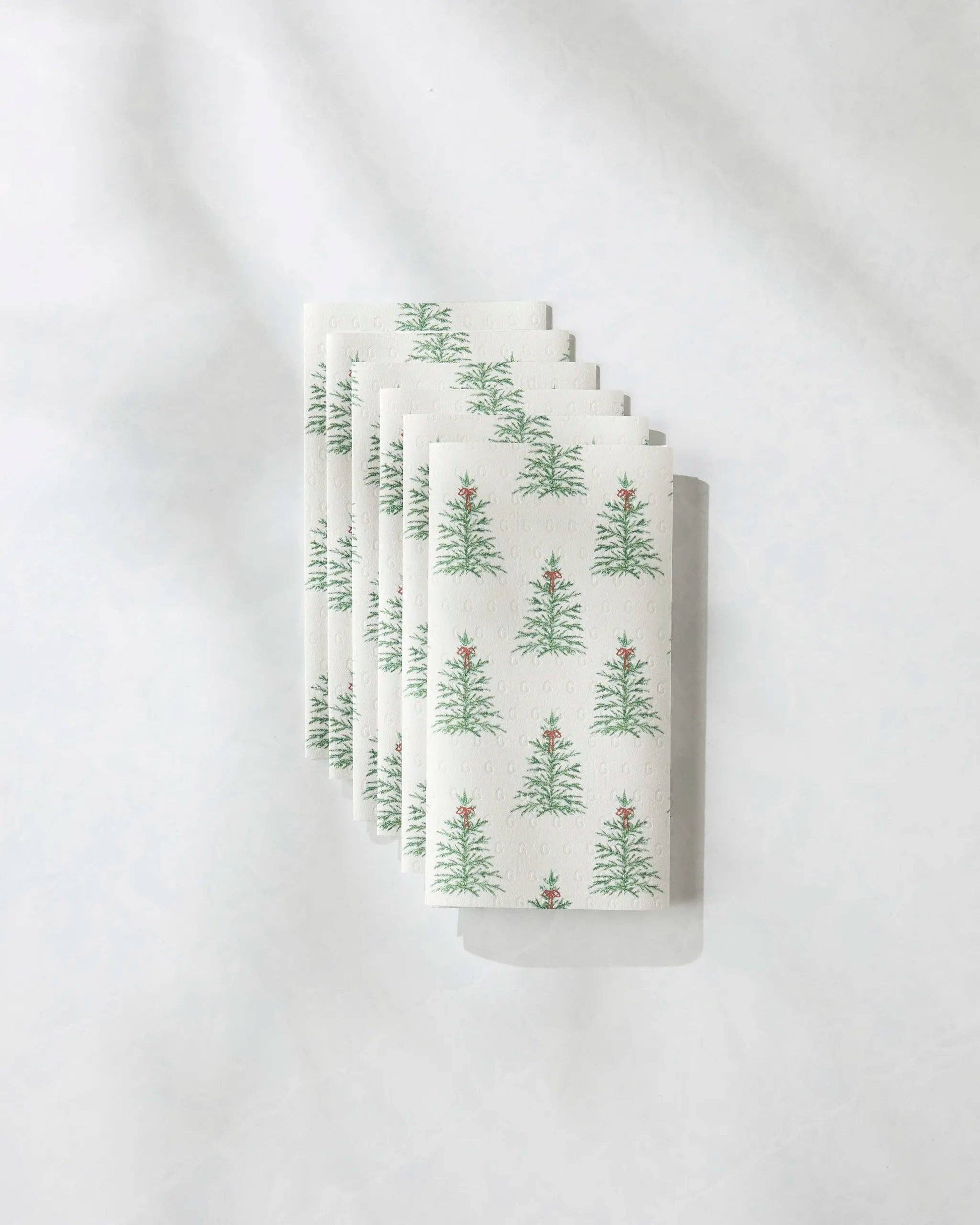 Geometry Not Paper Towel Set of six white towels with green tree pattern on a white background