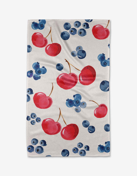Festive towel with cherries and blueberries on a white background