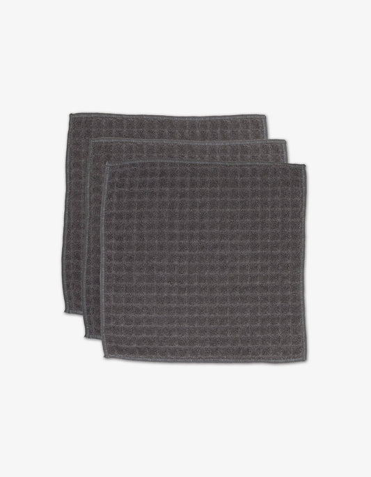 Geometry Waffle Washcloth Set Charcoal  set of 3 dark gray textured towels stacked on a white background