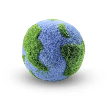 Wool dryer ball with green and blue design on a white background looks like earth