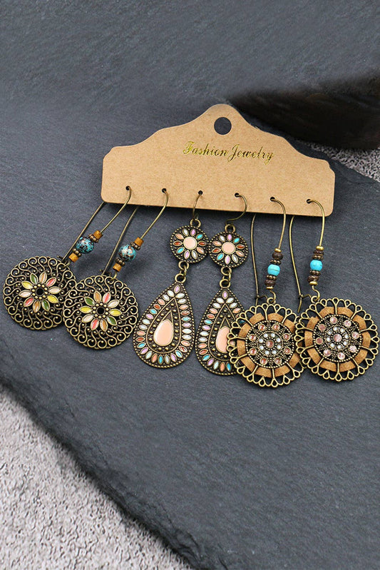 Set of ornate earrings on a 'Fashion Jewelry' card against a dark background