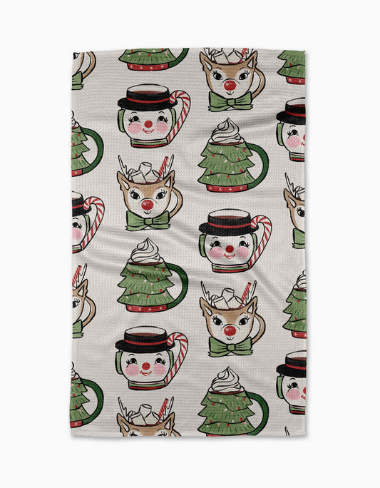 Geometry Tea Towel Patterned fabric with Christmas-themed designs including reindeer, hot chocolate cups, and candy canes on a white background.