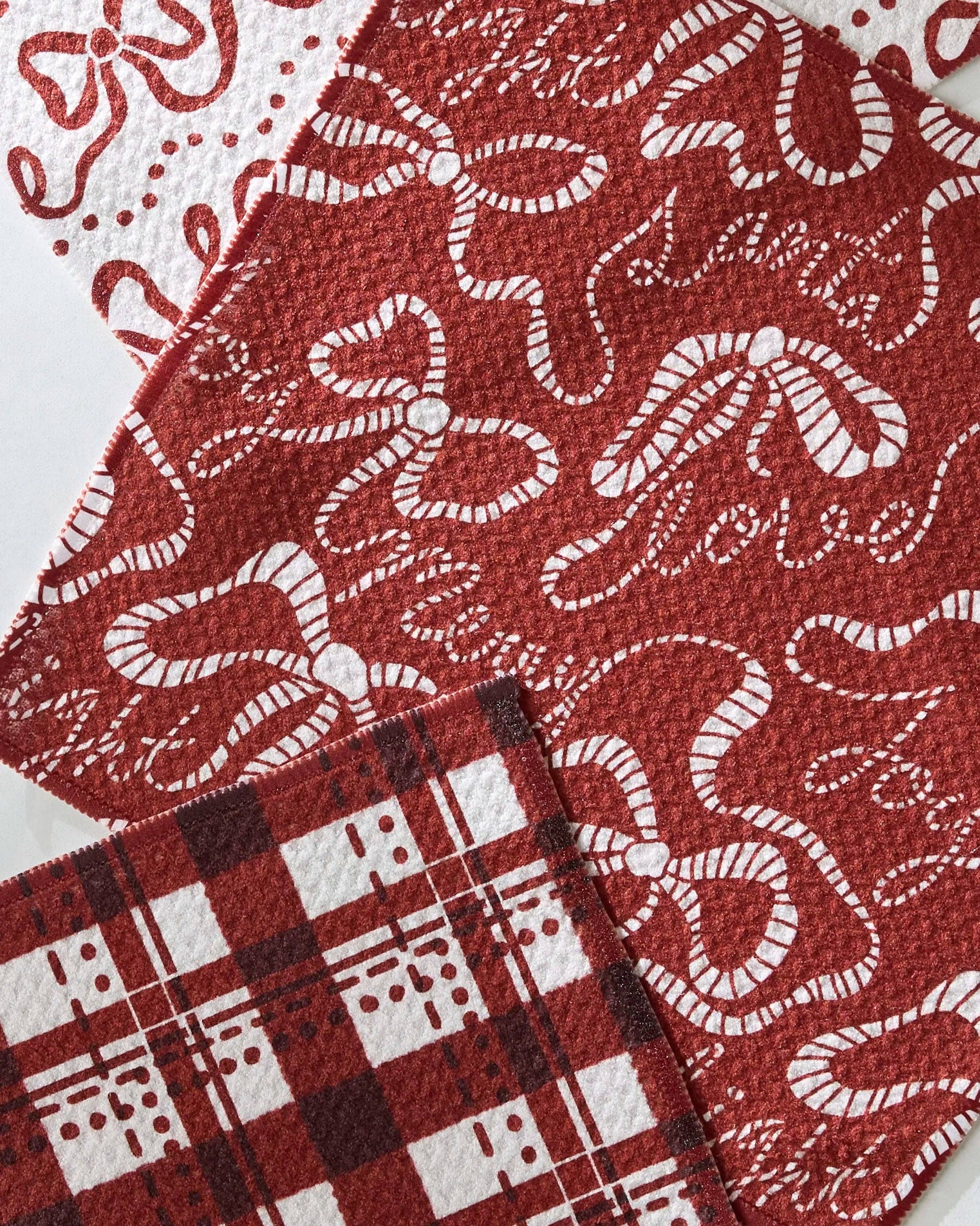 Geometry Dishcloth Set of three fabric swatches with different patterns on a white background