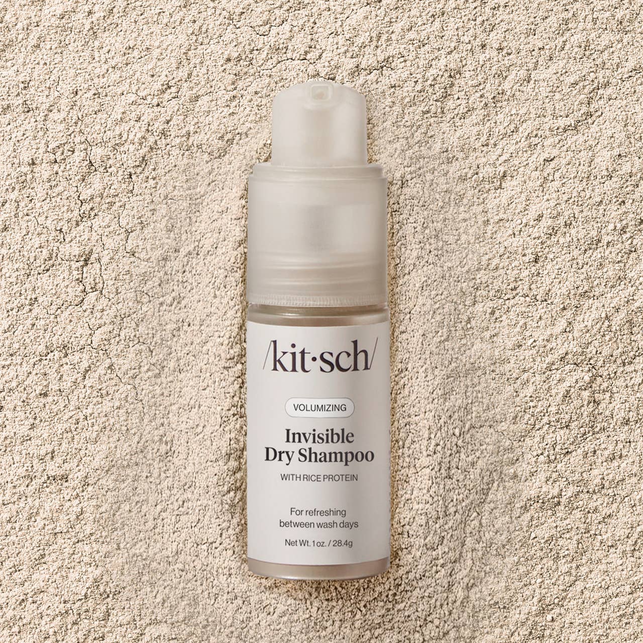 The image shows a packaged and pump bottle of Kitsch Volumizing Invisible Rice Protein Dry Shampoo, indicating it is for refreshing between wash days.