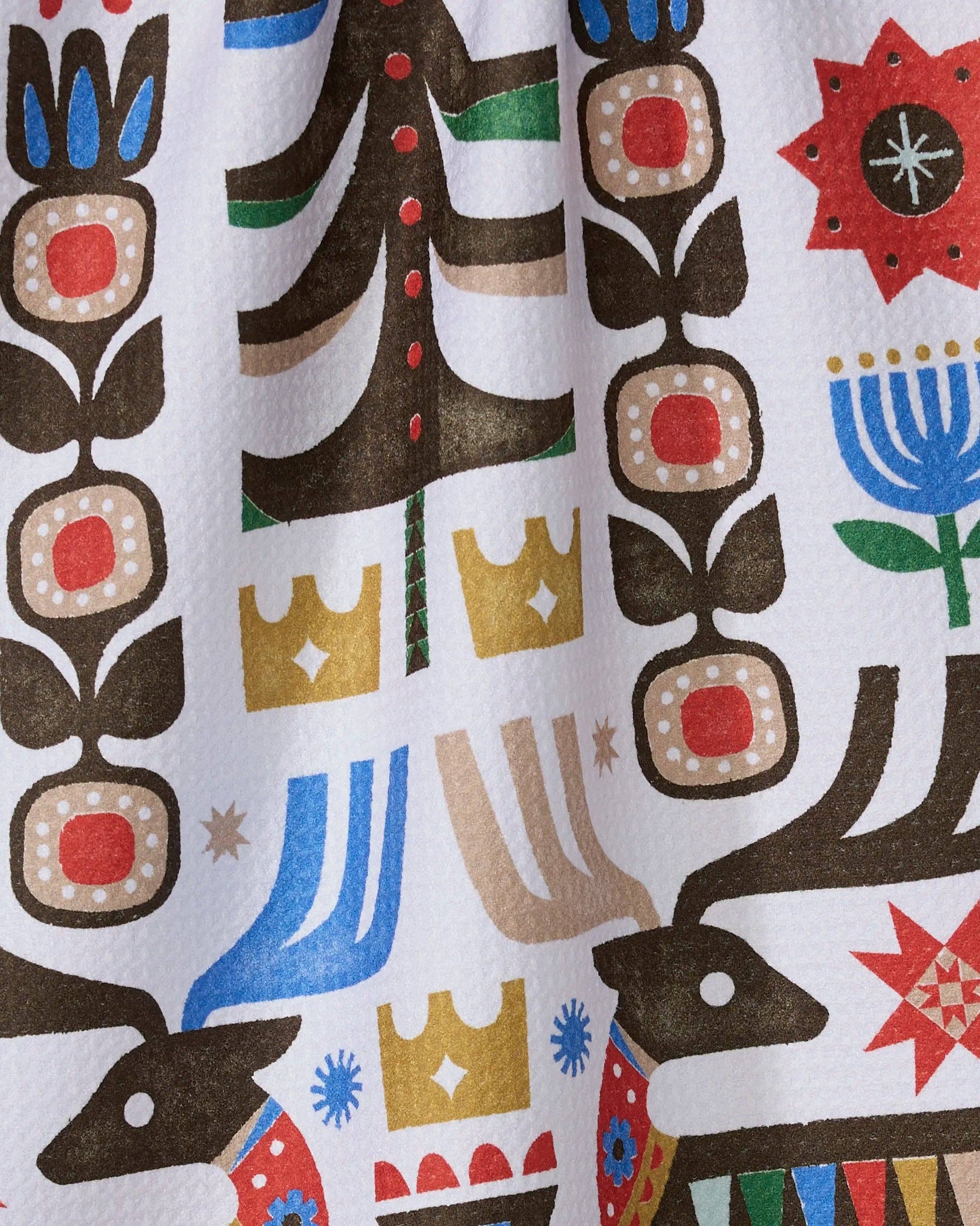 Geometry Tea Towel Everfolk  Colorful patterned fabric with abstract designs on a white background