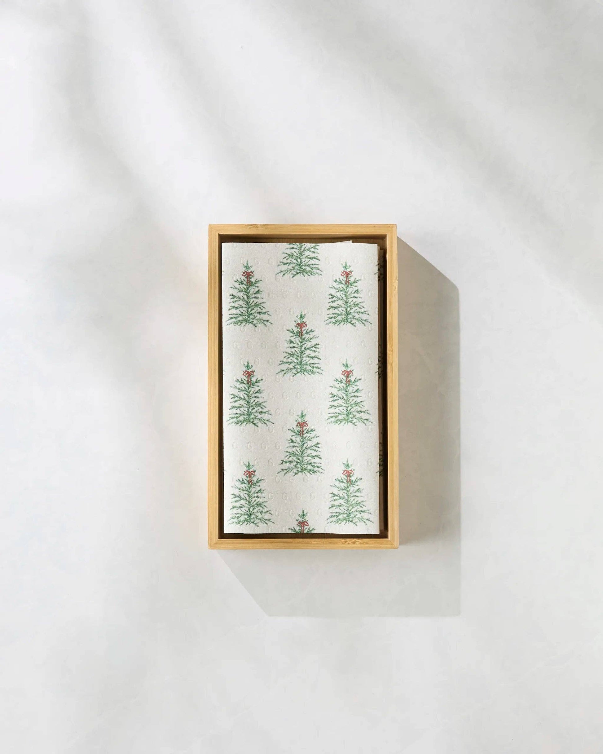 Box of tea towels with Christmas tree pattern on a white background
