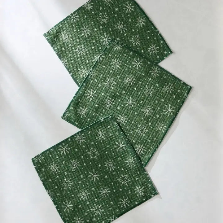 Set of three Geometry dishcloth towels with snowflake pattern on a white background