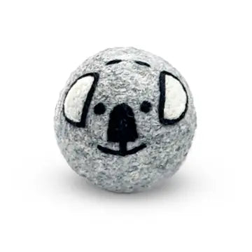 Gray wool dryer ball with a koala face on a white background