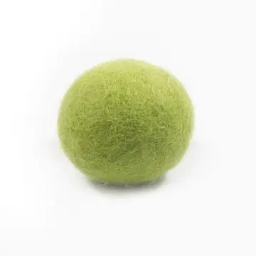 Green felted wool dryer ball on a white background