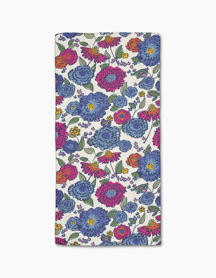 Floral patterned Geometry bar towel with blue, pink, and purple flowers on a white background