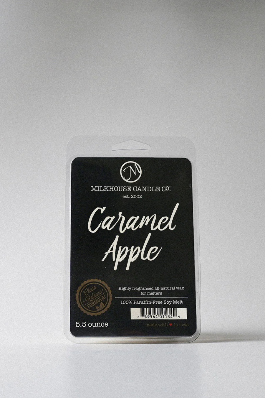 Milkhouse Candle Co. Caramel Apple wax melt packaging on a gray background