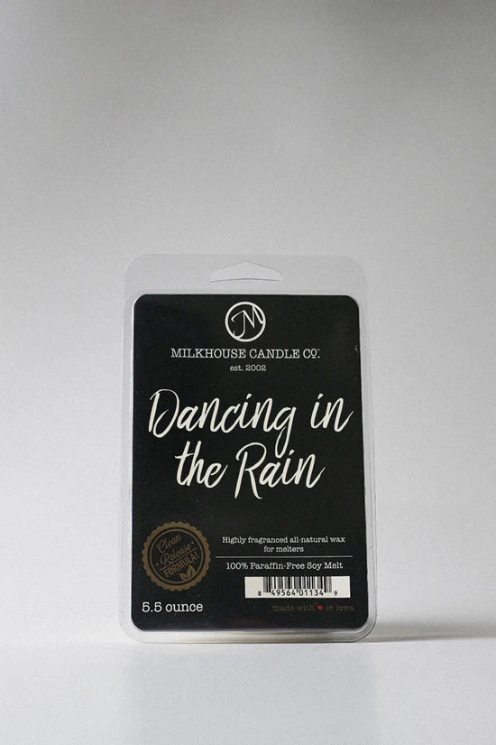 Milkhouse Candle Co. wax melt packaging labeled 'Dancing in the Rain' on a gray background