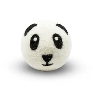 White wool dryer ball with panda face design on a white background